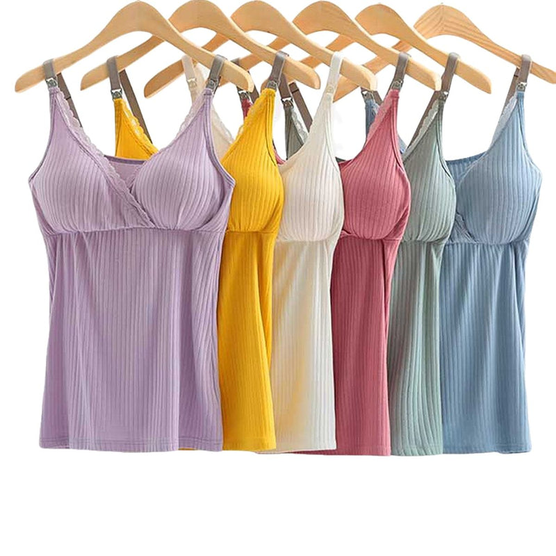 Set of colorful ribbed tank tops hanging on wooden hangers against a white background