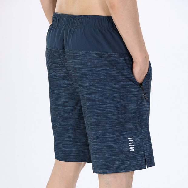 Navy blue athletic shorts with a white background