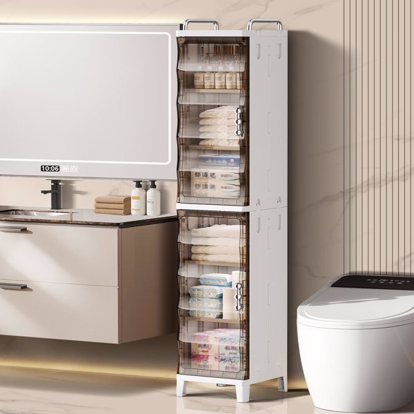 Tall white storage cabinet with transparent doors in a bathroom setting.