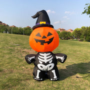 Halloween inflatable decoration with pumpkin face, witch hat, and skeleton body on grass