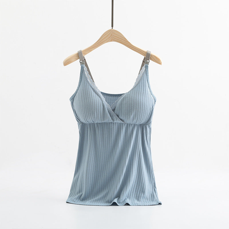 Light blue camisole on a wooden hanger against a white background