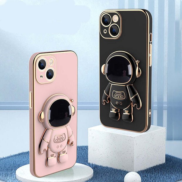 Two phone cases with astronaut designs on a blue and white background