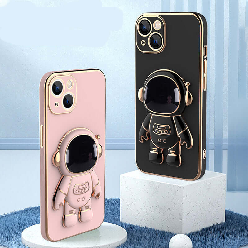 Two phone cases with astronaut designs on a blue and white background