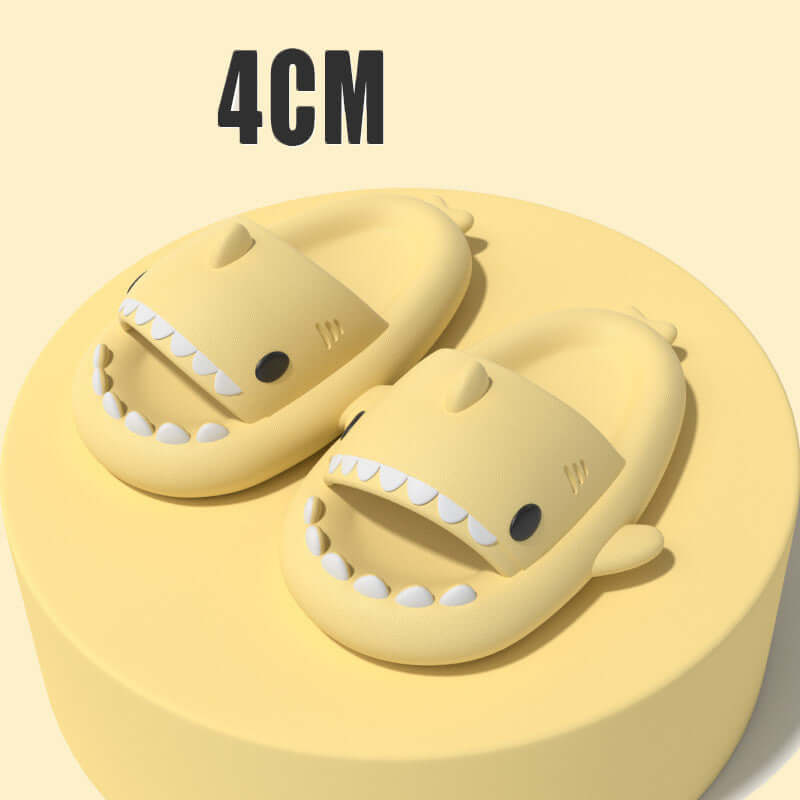 Yellow cartoon shark slippers on a yellow base, featuring a 4cm height, perfect for fun indoor or outdoor wear.