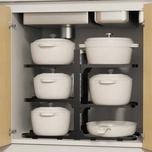 Cabinets with white pots and pans on a black rack