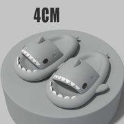 Sharky slippers for adults featuring cartoon shark design, showcasing 4cm thick soles on a display pedestal.
