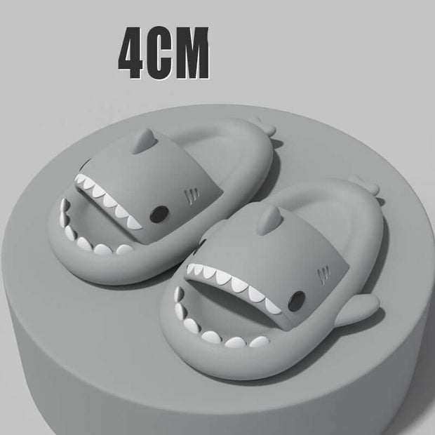 Sharky slippers for adults featuring cartoon shark design, showcasing 4cm thick soles on a display pedestal.