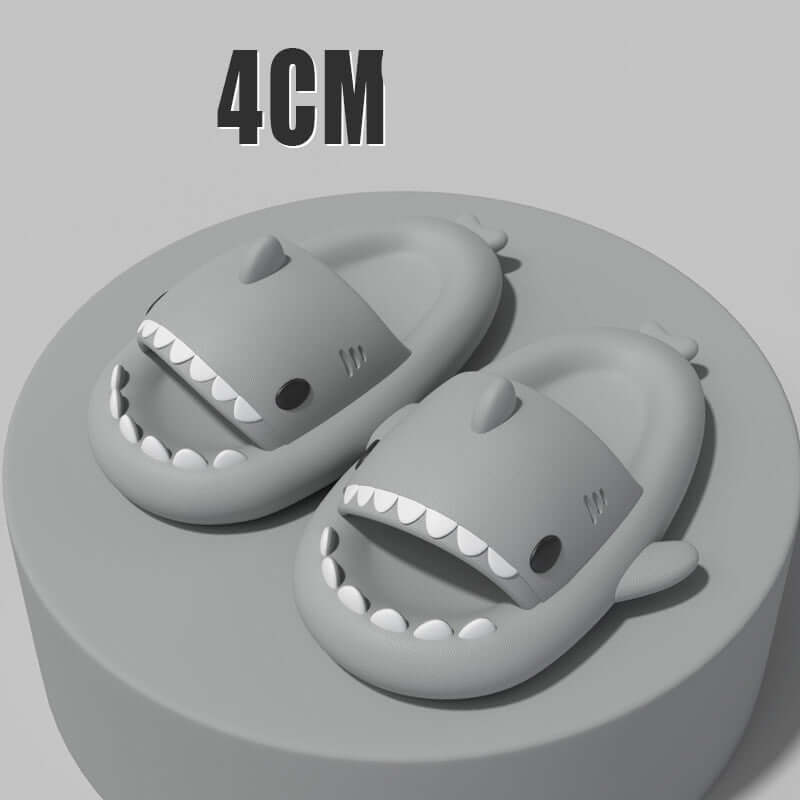 Sharky slippers for adults featuring cartoon shark design, showcasing 4cm thick soles on a display pedestal.
