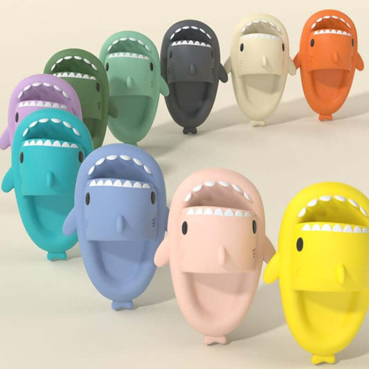 Colorful cartoon shark slippers for adults, showcasing various hues and playful designs, perfect for indoor and outdoor use.