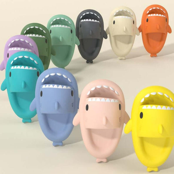 Colorful cartoon shark slippers for adults, showcasing various hues and playful designs, perfect for indoor and outdoor use.