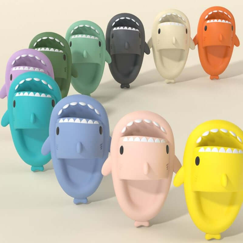 Colorful cartoon shark slippers for adults, showcasing various hues and playful designs, perfect for indoor and outdoor use.