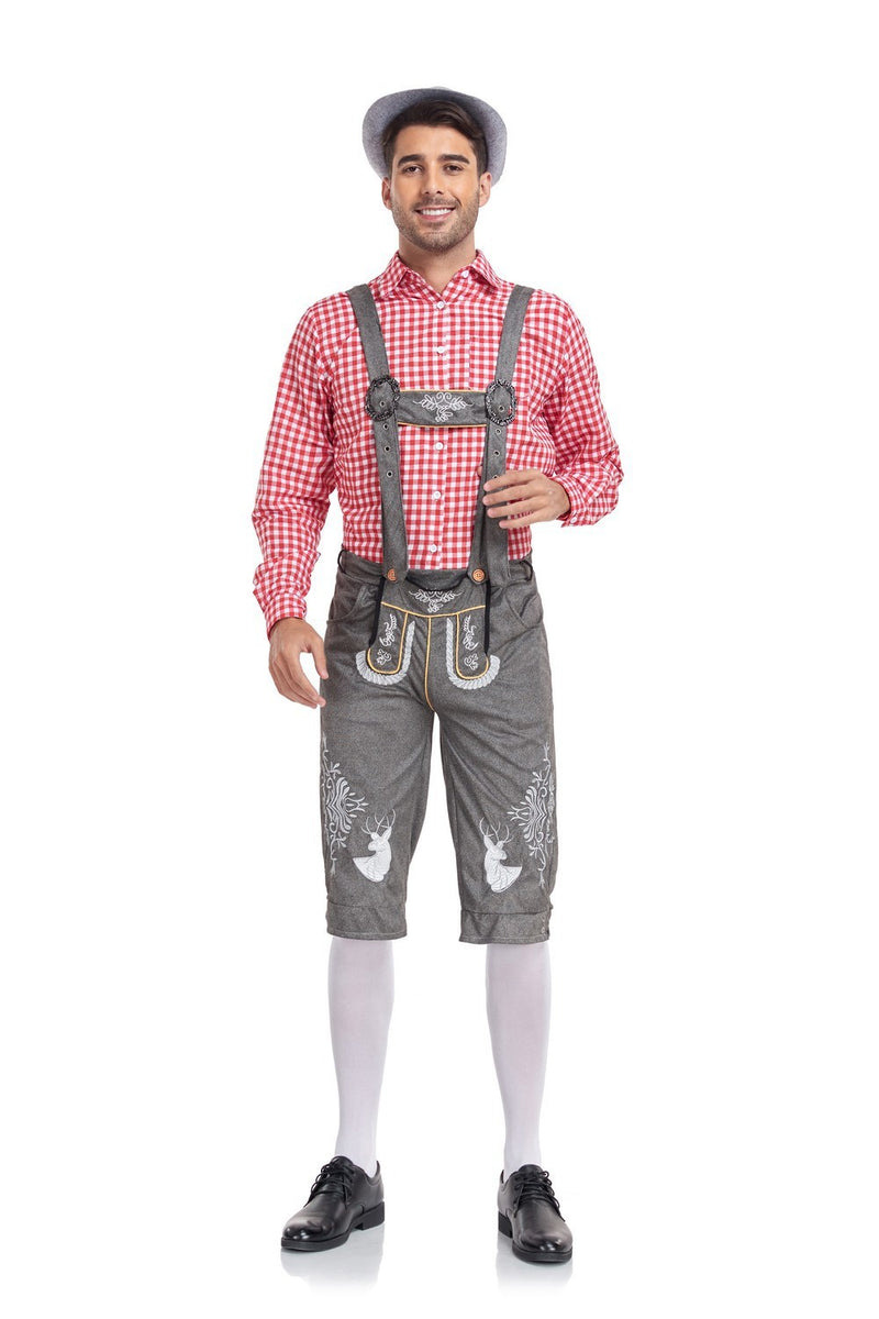 Man wearing traditional Bavarian lederhosen and checkered shirt on a white background