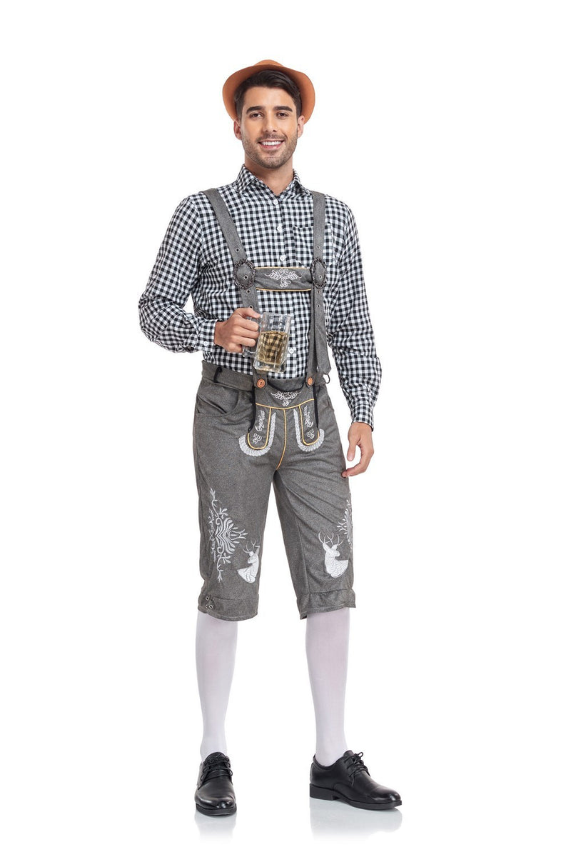 Man in traditional Bavarian outfit holding a beer mug on a white background