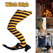 Black and orange striped stockings with witch shoes, suitable for Halloween decor.