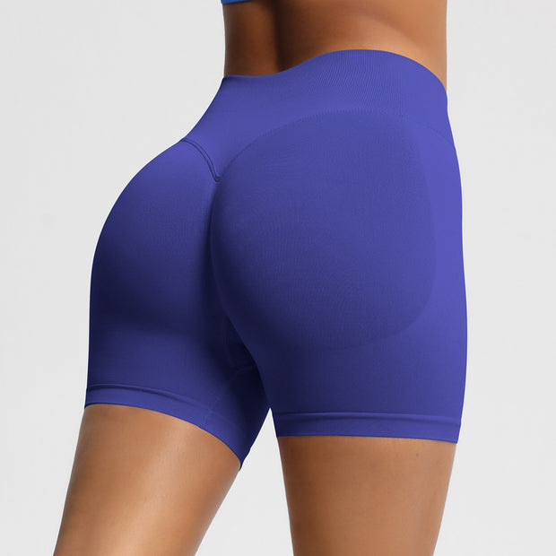 Blue athletic shorts worn by a person on a plain background