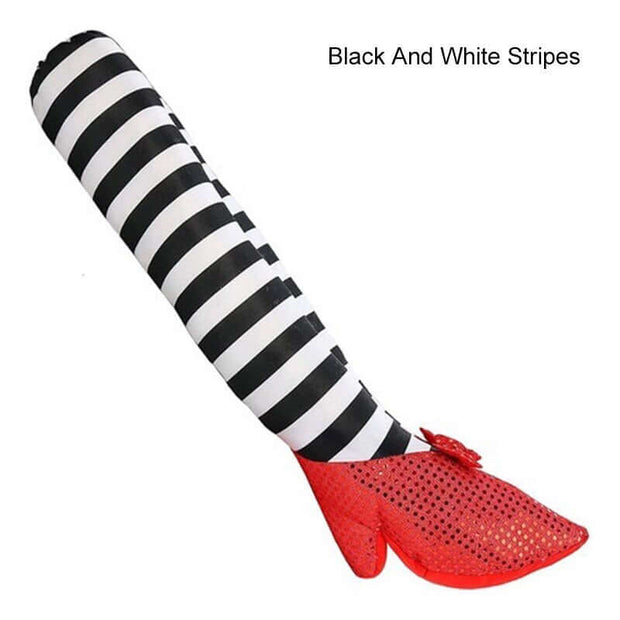 Glove with black and white striped cuff and red sole on a white background