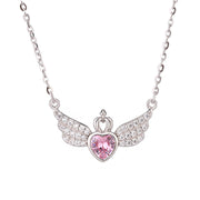 Necklace with angel wing design and pink heart-shaped gem on a white background
