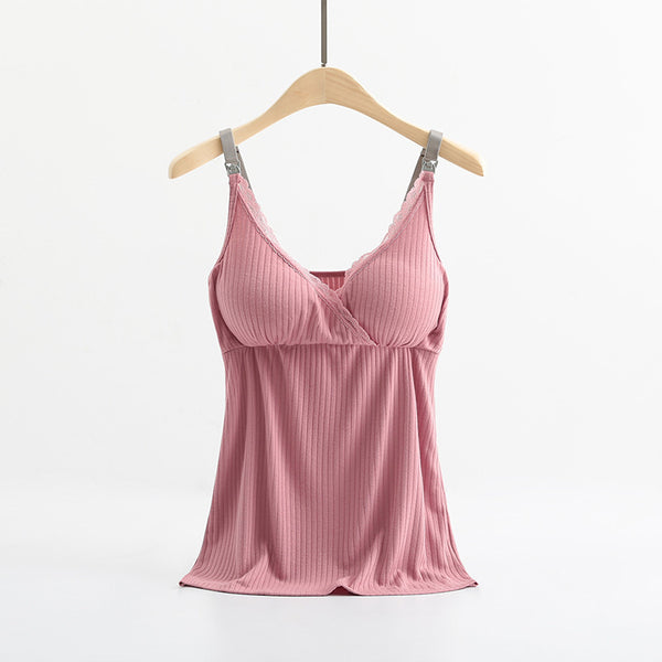 Pink ribbed camisole on a hanger against a white background