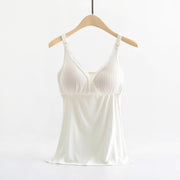 White ribbed tank top on a hanger against a white background