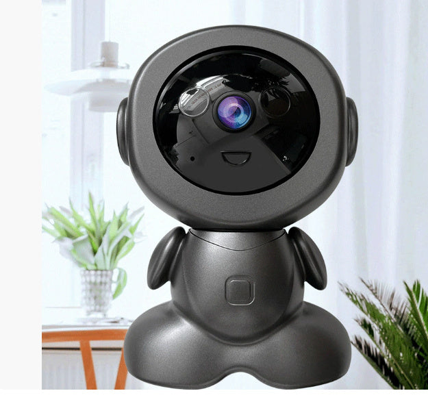 Black robot-like camera on a stand with a blurred indoor background