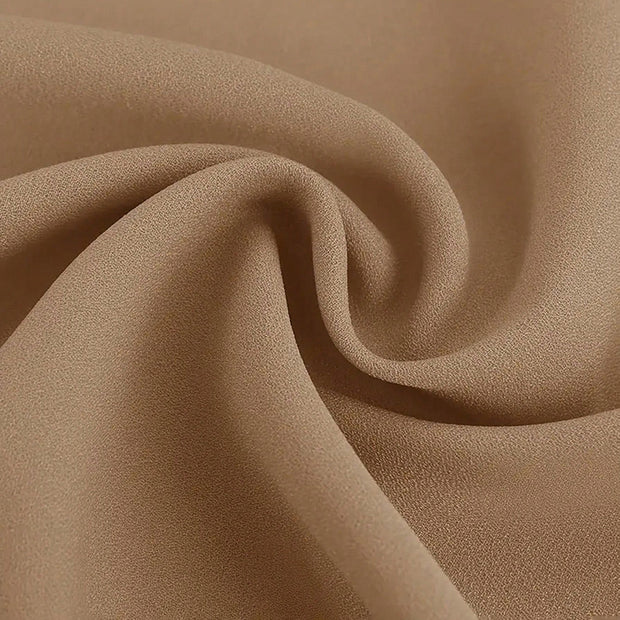 Close-up of beige fabric with a soft texture