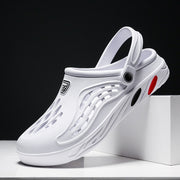 White sandal with a brand logo on a black background