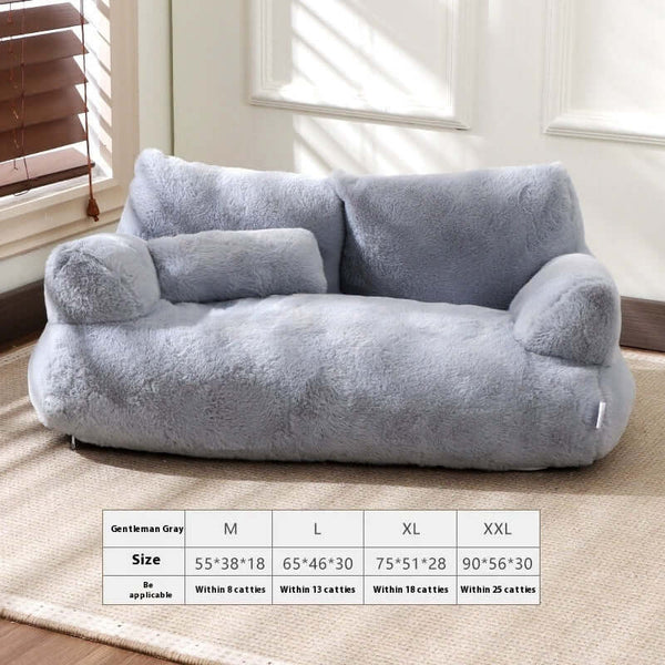 Gray pet sofa on a carpeted floor with size chart below