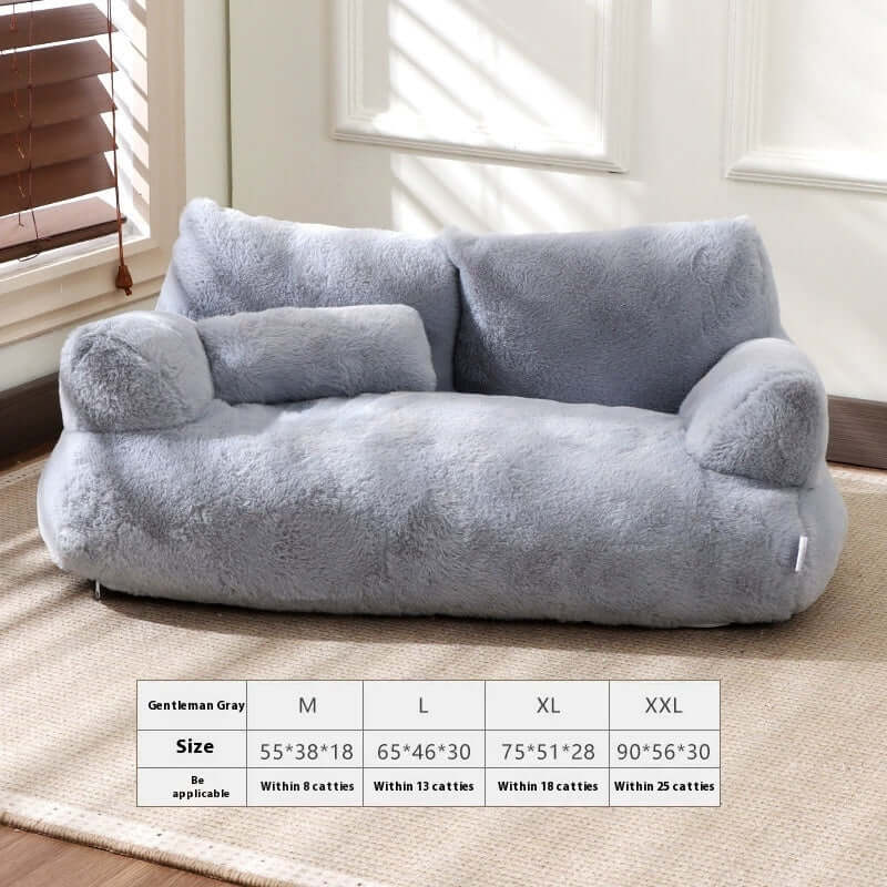 Gray pet sofa on a carpeted floor with size chart below