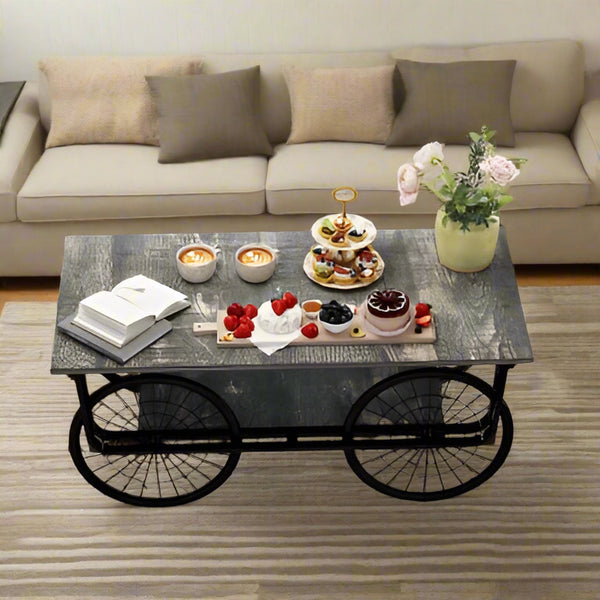 Coffee table with snacks and a book in a living room setting