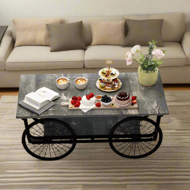Coffee table with snacks and a book in a living room setting