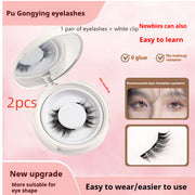 Pu Gongying eyelashes packaging with false eyelashes and white clip on a pink background