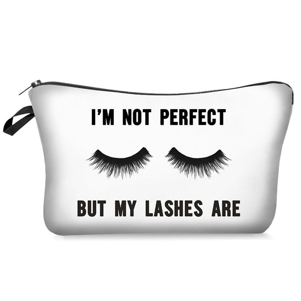 White pouch with black text and eyelash graphics on a white background