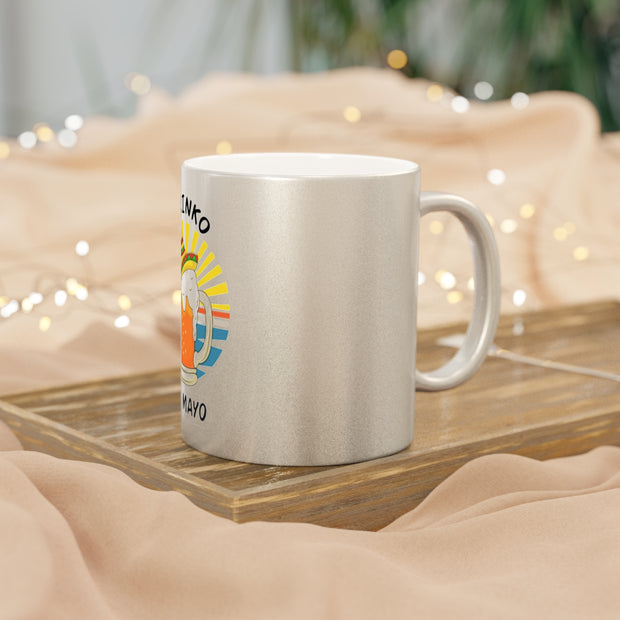 White mug with colorful design on a wooden tray with a soft, blurred background
