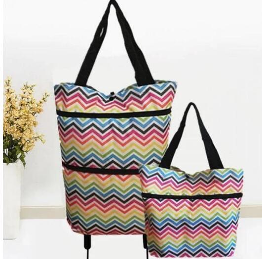 Two colorful chevron-patterned bags with black straps on a white background.