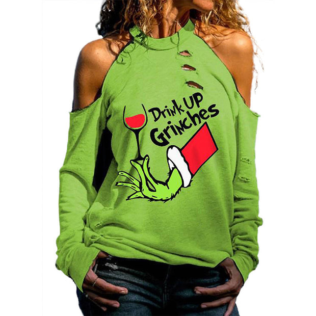 Green sweatshirt with 'Drink Up Grinches' design on a white background