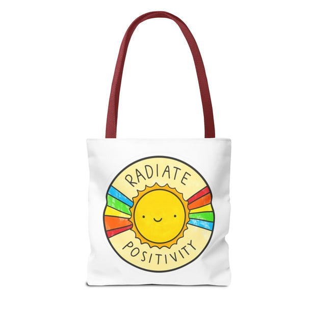 Tote bag with a sun design and 'Radiate Positivity' text on a white background