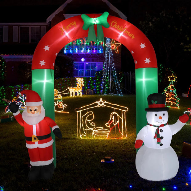 Inflatable Christmas arch with Santa Claus and snowman, decorated with lights and festive designs.