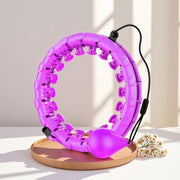 Purple exercise ring on a wooden stand with a light background