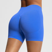 Blue athletic shorts worn by a person on a light gray background