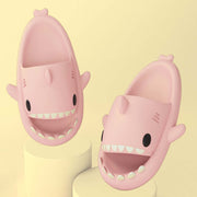 Pink cartoon shark slippers for adults, featuring cute design and comfortable fit for indoor and outdoor wear.