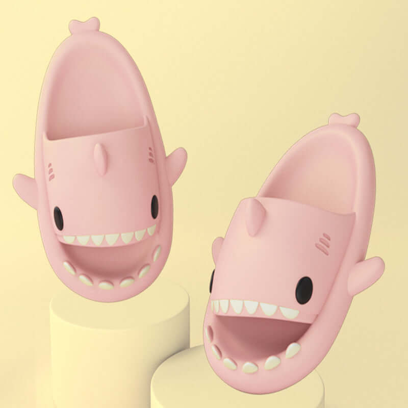 Pink cartoon shark slippers for adults, featuring cute design and comfortable fit for indoor and outdoor wear.