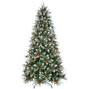 Decorated Christmas tree with snow, red berries, and pinecones on a white background