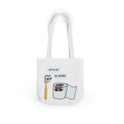 White tote bag with cartoon toothbrush and toilet paper design on a white background