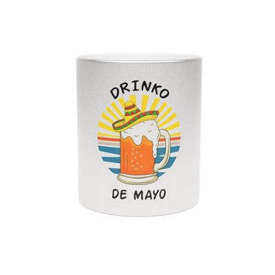 White mug with a colorful design of a beer mug and sombrero, featuring the text 'Drinko De Mayo' on a white background.