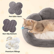 Cat lying on a gray pet bed with text labels on pet-safe fabric, non-slip bottom, and premium fillings.