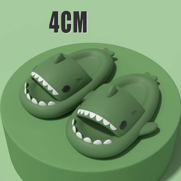 Green cartoon shark slippers with open mouths, designed for fun and comfort, featuring a soft, elastic build for adults.