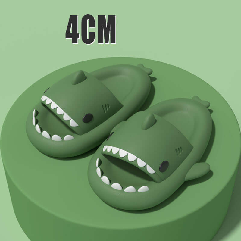 Green cartoon shark slippers with open mouths, designed for fun and comfort, featuring a soft, elastic build for adults.