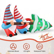 Inflatable Christmas gnomes and tree with LED lights and automatic blower features on a white background.