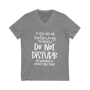 Gray t-shirt with white text on a white background
