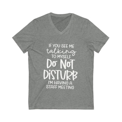 Gray t-shirt with white text on a white background